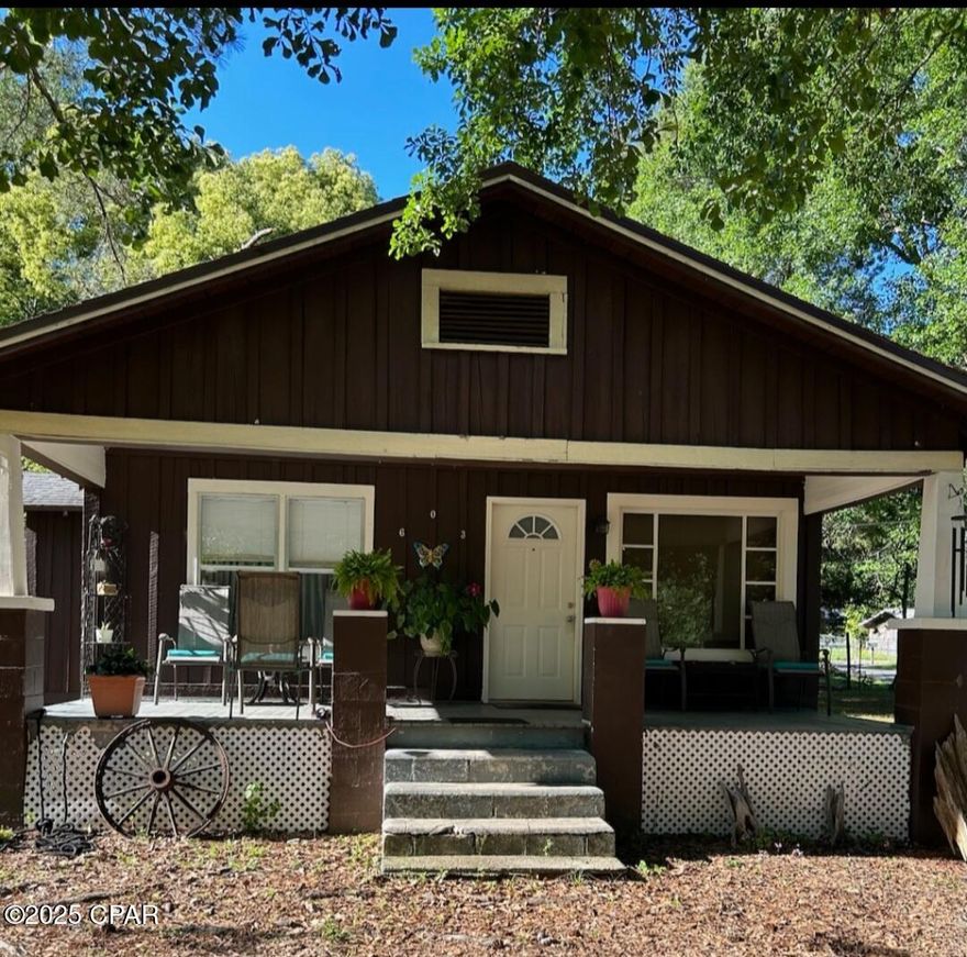Welcome to your charming retreat in the heart of Bonifay!  This cozy cottage-style 2 bedroom home, nestled on two spacious lots, offers a perfect blend of comfort and convenience.  The adjoining cleared lot has a water meter and city sewer hookup.  Recently remodeled, it boasts new laminate flooring, fresh interior paint, upgraded plumbing, and stylish ceiling fans throughout the house.  Relax and unwind in the yard around the firepit.  A new HVAC was recently installed.