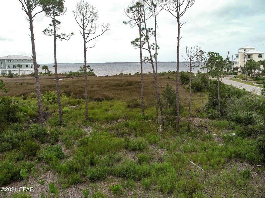 Great opportunity to purchase one of the few remaining water view lots on East Bay. This large .25 acre is close to Tyndall AFB, Eastern Ship Building, shopping, restaurants, and recreation.  This lot is partially cleared, offers water and sewer at the street, and is accessed by a paved road. This is the perfect location for an elevated home. Bring your builder!!!