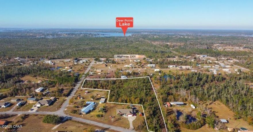 This is 4.98 acres located approximately 10 miles north of Panama City. You have the peace and quiet of the country but the closeness to town to make life simple and easy. This property has an access point on 2 different paved roads. The property also has a small stream running along the west property line.