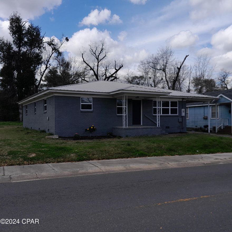 COMPLETE AND TOTAL RENOVATION! A very nice home within minutes to everything Marianna has to offer. 3BR, 2BA, PLUS DEN/ OFFICE! Covered Carport and nice, large backyard for your enjoyment!  ALL NEW INTERIOR, including windows, doors, bathrooms, flooring, kitchen cabinets, counter-tops, lighting AND SO MUCH MORE!  Must See, Show, and Sell.