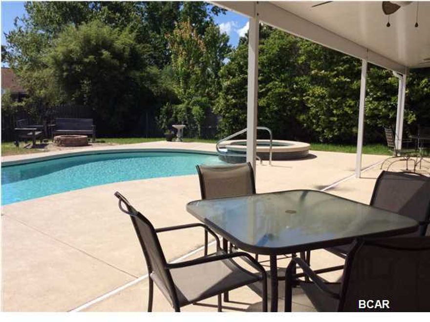 Make an offer! And this piece of paradise can be yours... a sense of place where you can relax and enjoy the great Florida weather all year long. Imagine after a hard day's work, sipping a cocktail in your Jacuzzi and then a swim in your gas heated pool and then putting something on the grill and eat outside, invite guests because the owners included the 2 patio tables and chairs with the home. All new stainless appliances with ice and water dispenser. You will love this impressive wood beamed vaulted ceiling open huge space of a combined living and family room, a stone wood fire place and and great quality dark wood color floors open to a design pattern tiled Dining room floor and Kitchen. This home and the pool comes with a year home warranty. Come see it , you'll be impressed!