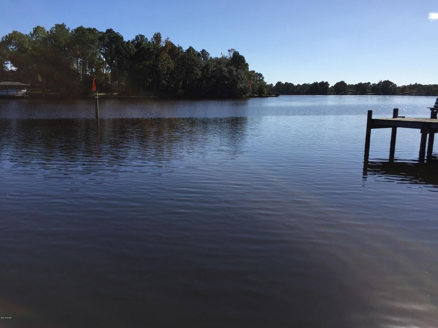 Waterfront! Direct Bay Access! Large Lot! Main part of this house is CBS concrete block construction! Good bones. The bedrooms are large! Aside from the kitchen there is a pantry with extra freezer and refrigerator. Large utility room. There are two outbuildings with power. This home has a dock, seawall and potential for large boats. The house is on well for water, and is hooked up to city sewer.