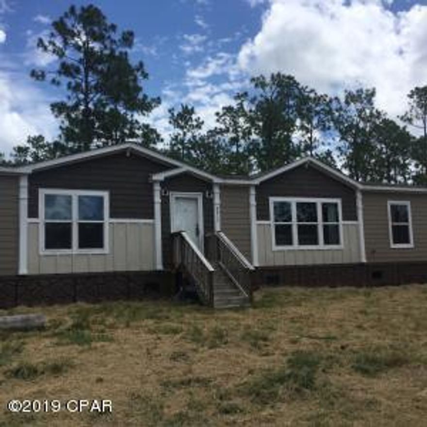 Welcome home!! When you walk into this home you won't believe this a manufactured home. Sheetrock walls, granite counter tops in the kitchen, large master bathroom with tile shower and amazing soaker tub. 2 dreive ways. Check out the farm door that hides the pantry in the kitchen. Extra large laundry room with lots of cabinets and area to fold clothes. Not to mention the laundry has a chalk board and a laundry chute to the bathroom. Large bedrooms and plenty of closet space. Beautiful deck on the back of the house with plenty of shade to sit and enjoy nature. Split bedroom floor plan as well as an open floor plan from family room to kitchen. Almost 5 acres the possibilities are endless with the what you can do with the yard. All information and measurements are to be verified by buyer.