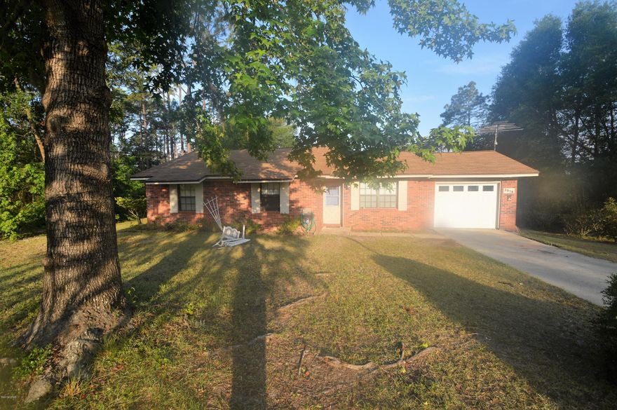 This home is located in the Sunny Hills Community. With open space in the living and dining room, this home is ready for you to entertain.  The master bedroom features a large walk in closet.  The home has a large Florida room, as well as a nice attached screen porch.  There is also an outbuilding with electricity.
