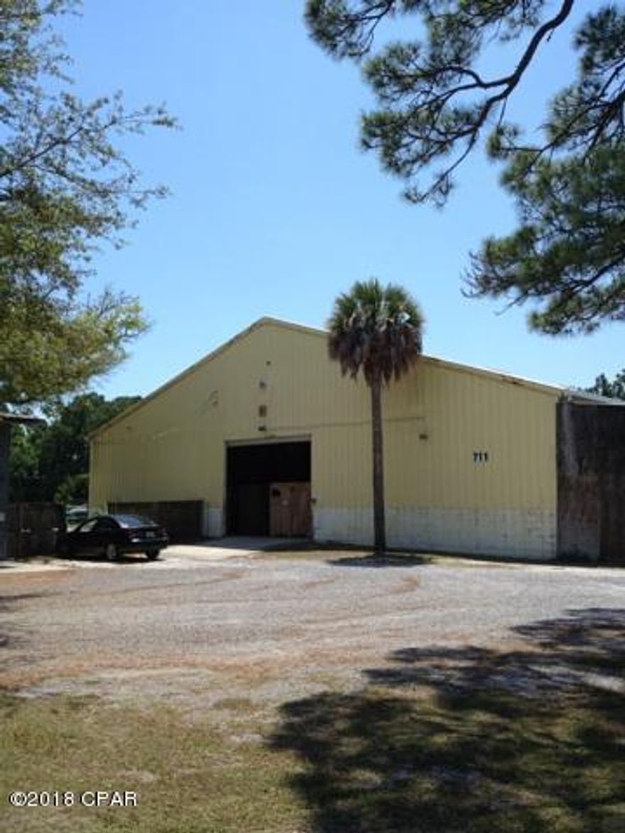 This Downtown Panama City warehouse complex is a combination of 3 separately addressed buildings, each with private yards that can be leased separately or combined and are perfectly suited for a wide variety of commercial uses to meet the needs of large or smaller company operations. The building at 711 Mulberry includes a 12,800 Sq. Ft. warehouse with a dock high loading dock and three ground level 12X14 Ft. roll-up doors.  A shared common area is located onsite to accommodate tractor trailer activities. Additional buildings with private yards are located at 733 & 761 Mulberry Avenue and are listed separately in MLS. Lease individually, in any combination of facilities or the entire complex.  All buildings are tenant occupied, early termination is possible. Lease Everything - $12,500/Mo.