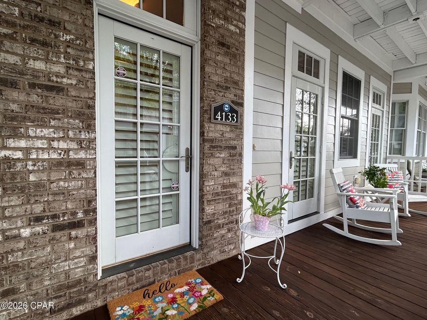 Situated in the gated community of Waterhaven--a southern coastal enclave on
the scenic St. Andrews Bay--this magnificent three-story townhome delivers an unparalleled
blend of elegance and comfort. The neighborhood features charming cobblestone streets and
provides a secure, tranquil atmosphere. The residence boasts four bedrooms, four and a half
baths, and includes a separate carriage house with a full kitchen, bedroom, and bathroom
above a spacious two-car garage. This unique configuration creates an ideal retreat for family
and friends.

The main house spans three stories and showcases stunning architectural details such as heart
of pine hardwood floors, trey ceilings, Chicago brick, and meticulous millwork with 12-inch baseboards and
crown molding. Plantation shutters brighten the rooms, while the warmth of hardwood flooring
enhances the inviting ambiance. Upon entry, you are welcomed into an open-concept living and
dining area that seamlessly connects to a high-end, gourmet kitchen. Designed for aspiring
chefs and entertainers alike, the kitchen is adorned with granite countertops and professional-
grade appliances, including a Sub-Zero refrigerator, a Viking 6-burner stove with convection
oven, a Bosch dishwasher, and two Sub-Zero wine chillers at the wet bar.

Elegant French doors in the dining room open to a serene private courtyard, inviting relaxation
with a book, preparing a gourmet meal on the grill, or hosting gatherings under the stars.

On the second floor, the primary suite features a generously sized walk-in closet and an ensuite
bathroom with a double vanity, separate shower with dual showerheads, and a luxurious jetted
soaker tub. A private balcony completes the southern row home vibe, providing an inviting
space for morning coffee or quiet reading. Across the hall, the guest room includes its own
ensuite bathroom and a balcony that overlooks the courtyard below. The third floor features
another guest room with brand new carpet, ensuite bathroom, and additional climate-
controlled storage closets.

Above the two-car garage, the carriage house presents a fully equipped private getaway. This
space includes a cozy sitting area, kitchen, laundry, bedroom, and full bathroom, making it an
ideal option for extended family, guests, or a home office.

As a resident of Waterhaven, you'll enjoy access to a variety of resort-style amenities. These
include a bay front pool and the largest pier on the bay with marina, with both public and
private boat slips--for fishing, boating, or taking in breathtaking sunsets. The clubhouse
features a grand gathering room for events, a private theater, fitness center, summer kitchen,
and outdoor grilling stations. With HOA fees covering all amenities, landscaping, water, trash,
and exterior maintenance, the home provides a private, luxurious feel paired with the easy
lifestyle of condominium living. Viewing in person is essential to fully appreciate its charm and
elegance.