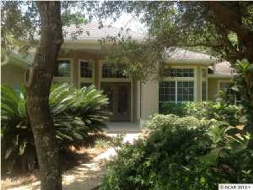 EXTERIOR OF HOME NEWLY PAINTED WITH ELASTOMERIC PAINT AND SCREENED PORCH REDONE! (July, 2014) How much better can this house get! This wonderful home in the Preserve has had many updates and shows like a new home! There are gorgeous hand scraped distressed bamboo wood flooring throughout the home put in within the last two years. Large kitchen with breakfast nook plus formal dining room. Travertine back splash, corian countertops. Most kitchen appliances have been replaced during this time frame, new Bosch dishwasher, built in microwave, refrigerator, and all appliances including washer and dryer convey with home. Most light fixtures have been replaced. Large master suite with big area for sitting room, nice master bath with double vanities, whirlpool tub and oversized separate