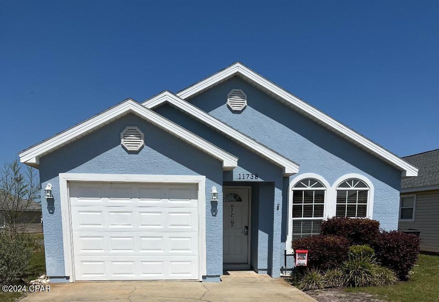 CURRENTLY UNDER CONTRACT, SELLER WILL CONSIDER BACKUP OFFERS PALM COVE Gorgeous Beach Home-Minutes from the Gulf of Mexico!  Welcome to your BEACH GET AWAY. Sink your toes in the white sugar sand!!!! 
 Beautiful beaches only 2 1/2 blocks away.  Impeccable attention to detail creates an inviting atmosphere throughout this home.  Amazing corner lot just steps from the front gate security, offering both privacy and ease of access.  Convenient sprinkler system, the lawn care by the association. Location close to Shipwreck Island Water Park, Restaurants, Shopping, Fishing Pier and so much more...  Luxury Vinyl Plank Flooring installed 2017 and still looks brand new adding both durability and charm to the home.  Enhanced by Vaulted Ceiling in Great Room.  Recent Upgrades:  New Roof, New HVAC, New Siding, and New Front and Back Doors Installed 2021.  New Dishwasher Installed 2023 ensuring years of worry-free living.  Community Amenities:  Enjoy the FUN and Relaxation of Two Community Pools, playground, BBQ and Grill, Picnic Area, Trash Pickup, Mowing and Trimming is provided by grounds maintenance HOA. This home has been cared for and serves as a second home for the Sellers.  Wonderful Rental Investment opportunity or Personal Home   in a Great Location!  SHORT TERM RENTAL PERMITTED.  All measurements approximate please verify All information that is important to you.  All Blinds, and Window Treatments Stay. Living room shelves and white shelves in second bathroom stay. CALL LISTING AGENT FOR SHOWINGS.