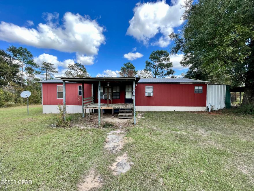 Discover the charm of this secluded 5-acre fixer-upper retreat, offering the ultimate rural escape. With a new roof installed in 2018, this 3-bedroom, 2-bathroom mobile home provides the canvas for your dream home in a serene, private setting. The newer siding and insulation ensure both comfort and energy efficiency. The addition of a new well pump and tank in 2021 guarantees a reliable water supply. Embrace the homesteader in you with several chicken coops, and the spacious storage building with electricity is ideal for your workshop or storage needs. Nestled away from the noise of city life, this property accessed via private road and deeded easement, promises tranquil living and the opportunity to create your perfect rural haven. Don't wait to seize this chance to make your countryside living dreams come true! Contact us today to schedule a viewing and envision the potential that awaits you. Cash only, as-is the home will not qualify for financing!