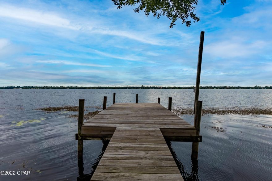 All sizes are apx-taken from Tax Records///!/////! WATERFRONT--ON BIG PART OF BEAUTIFUL DEER POINT LAKE------vinyl/frame home situated on great LOT (.73 acres) Fantastic view from your dock-Sea wall---very nice 3/2-newer roof, new A/C/Heat, new insulation, new wiring--lots of extra's--home has a permanent gas GENERATOR if Electricity goes out--You can NOT beat the location of this home!!!