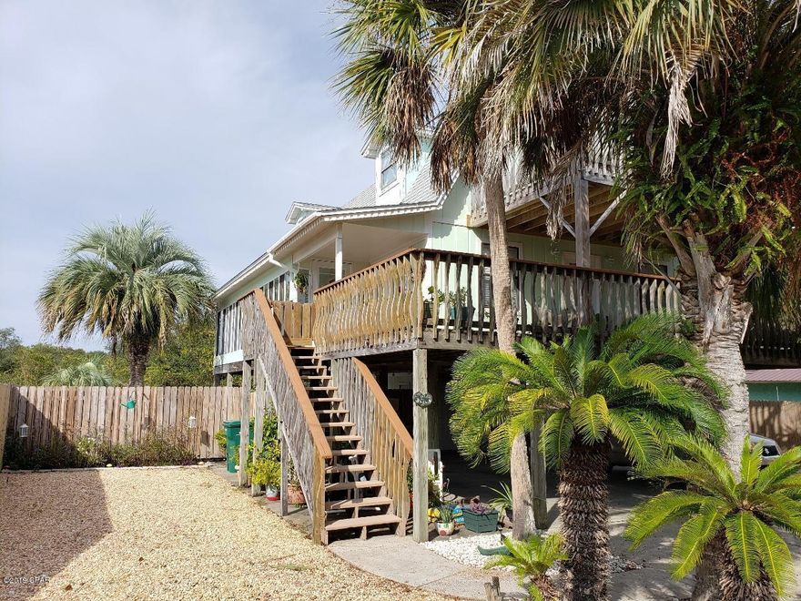 Located on the west end of Panama City Beach, 1 1/2 blocks from the beach, not in a flood zone and no HOA  fees makes this the perfect beach house for full time residents, your vacation home or investors!This great home features 3 bedrooms (each with their own full bath), half bath downstairs, laundry room dining area and living room, vinyl plank flooring throughout the 1st floor, leather granite kitchen counter tops and new dishwasher. The master bedroom is located on the first floor. Walk out the dining room doors to a covered deck in front and enclosed sun room on the south side. Two additional bedrooms are upstairs with a covered deck off of the front one. On the ground level there is a work shop with a combo heat/cool window unit.  The back yard is fenced and offers an 15' x 30' in-ground pool, covered patio area with outdoor ceiling fan and a new Greenhouse featuring lights and ceiling fan. There is a lean-to that protects the pool equipment.  The back yard is your own little piece of paradise.  There's plenty of parking with 2 car covered parking and 2 driveways.  Sit outside and feel the gentle sea breezes and listen to the waves crashing on the beach.  This Amazing Beach House is A Must See!!  Call today for appointment.  Owner is a licensed Real Estate Agent.