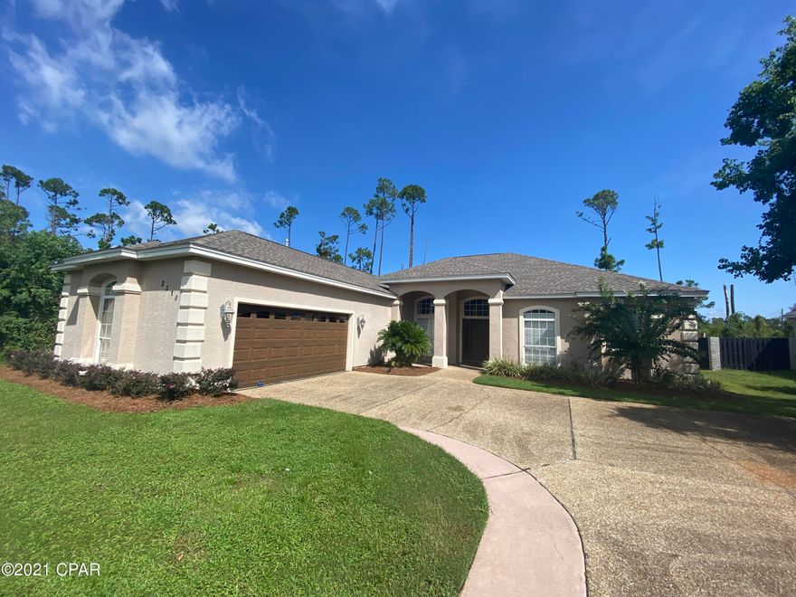 This newly remolded home is in one of the most sought after subdivisions in Panama City Beach, The Preserve. The inviting entry opens into a formal living room and dining room with 12 ft ceilings and crown molding throughout. Home features brand new hardwood floors and new carpet in 2 of the 4 bedrooms. Kitchen comes with beautiful granite countertops and stainless steel appliances that overlook the family room with fireplace and breakfast area. This home has a very spacious Master Bedroom with his and her closets and a newly remolded Master Bath. This split floor plan has 2 bedrooms adjoined by a jack & jill bathroom. Home has a mud room and an outdoor screened in patio. Home comes with installed alarm system, irrigation system and a new roof! Great Neighborhood and MOVE IN READY!!