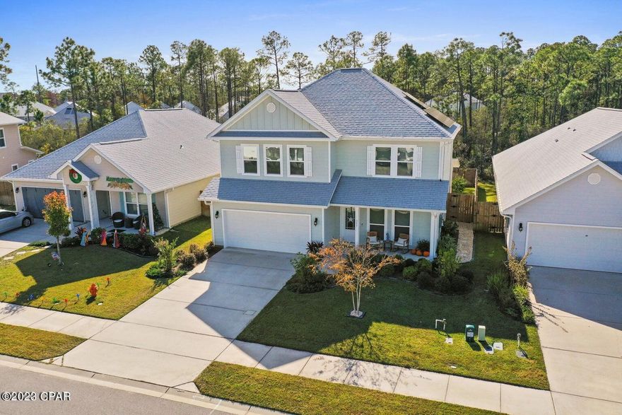 Amazing location for this 2 story 4 bedroom 3 bath home located just a short distance to the  Navy base, and a short drive to the sugar white sands that Panama City Beach is famous for, This home is in pristine condition and includes many beautiful upgrades to include, landscaping, a variety of fruit trees, an outdoor shower, extra outdoor storage, garage shelving, solar panels, fresh interior paint, a new refrigerator, backsplash and security system.