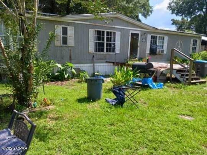 Spacious mobile home with a brand new kitchen and flooring. This 1,716 sq ft home sits on a nearly half-acre lot with no HOA, offering you freedom and space. The interior is ready for your personal touch. A little TLC will make this house your home.