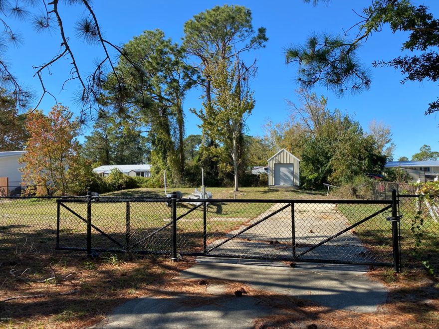 PANAMA CITY BEACH Cleared 80X135ft lot, fully fenced with a gate. The lot also features a driveway and a septic tank is already on site, city water is available. Located approx 3 miles from the gulf of Mexico. Single family, townhomes and modular homes are allowed per the City. Duplexes/Triplexes/Quadplexes and multi-family are allowed with additional standards. Zone: R-2 (Limited Multi-family). Shed on property does not convey and mobile homes are not allowed. Buyer to call the city and verify minimum standards and what is allowed per zoning. All sizes and ages are approximate, please measure and/or verify if important.