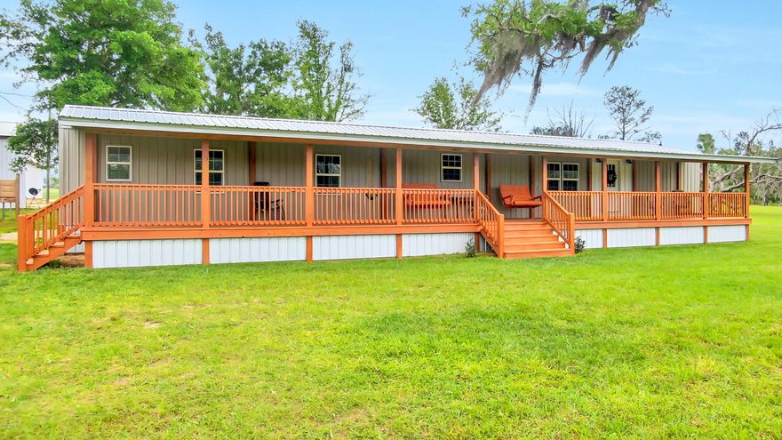 If Country living is the life for you, THIS is the perfect place to be! This is a fabulous opportunity to bring your horses & enjoy this peaceful secluded 40 acres of beautiful countryside. The property features a variety of hardwoods, spring fed pond with dock, enclosed 40x72' pole barn, 32x60' horse barn with 5 stalls, chicken coop, fenced pasture for the horses, 5 acre perennial peanut field. The completely remodeled mobile home has split bedroom plan & lots of updates including LVP wood-look floors throughout, Granite counter tops, stainless steel appliances, new cabinets/hardware, pendant lighting, fireplace, custom built-ins, new vanities in bathrooms, sheet rock walls, new metal roof, siding & windows & a beautiful covered wood deck runs the entire length of the front of the house. Sit here with your coffee and watch the surrounding wildlife! There are also several cleared areas on the property that are ideally situated to build a larger home if desired. Call today to come view this beautiful property and all it has to offer!
Buyer to verify all measurements if important.