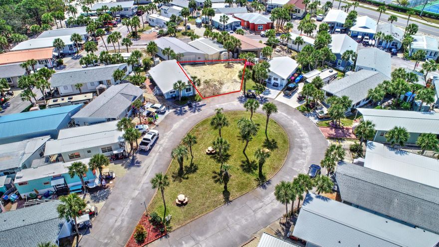 Build your dream home on the LARGEST available lot in the desirable Venture Out gated and waterfront beach community! This sought-after location boasts a grass courtyard in front and common area beside it, making this already big lot feel even more private and spacious! If you are looking for a place for your home, boat and two vehicles with room leftover for an outdoor kitchen, this is it!  It's like getting a double lot!  Imagine living life riding your golf cart to the private beach, St. Andrews State Park, local restaurants, the gulf and bay, boat slips and ramp, tennis courts, saltwater pools, club houses, fishing pier, mini golf, playground and shops!  Who needs a car? If you are looking for an investment, there is no better place with TWO vacation rental managers on property!