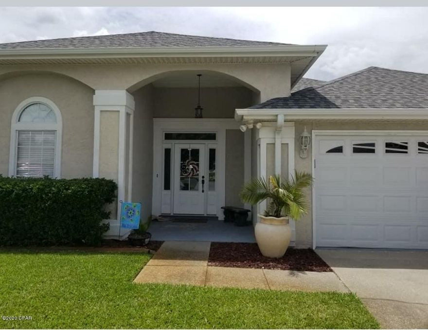 BEAUTIFUL HOME in Summer Breeze subdivision.   This home features a two car oversized garage with a split floor plan with travertine floors in separate living room with a gas fireplace and custom mantle, spacious dining room off of living room for easy entertaining, large kitchen with breakfast bar and custom oak cabinets, separate family room with beautiful hardwood flooring that could easily be converted to a fourth bedroom, large laundry room with utility sink, Back yard has a screened in porch and workshop with power that can be used as storage or an office. Truly a must see!!