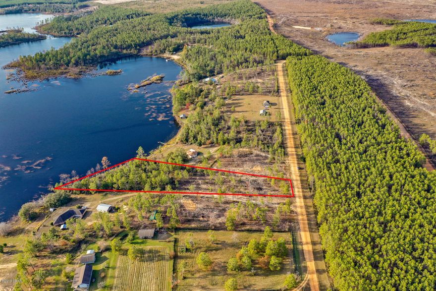 Build your dream home on this beautiful waterfront lot in Sunny Hills Area on Long Lake. Partially cleared lot in gated community, quiet serene setting fabulous view of the lake. All sizes are approximate. No improvements ready to build.