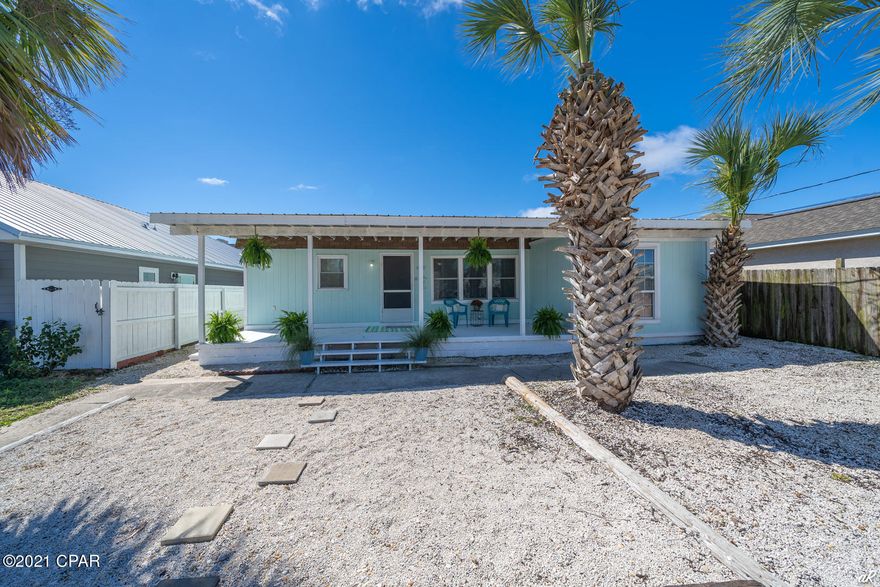 CURRENTLY UNDER CONTRACT -SELLER ACCEPTING BACK UP OFFERS! This three-bedroom Beach Home is nestled in the desirable Holiday Beach Community and is just a ten-minute walk away from the sandy beach. The covered porch is perfect for entertaining. This classic beach home would make an ideal family retreat, second home, or investment property. Short term rentals are allowed, currently grossing approximately $38,000 a year.  The large sand yard is completely privacy fenced. The kitchen is updated with stainless steel appliances, rich gray cabinets with tile accent wall that opens to the living area. The master bedroom has an oversized closet and a master bathroom. There is also a separate laundry room.  Golf cart friendly community with great schools and 1 block from public boat ramp into Grand Lagoon, which leads to Shell Island. Seller is offering a Home Warranty and has a Survey. 
All measurements should be verified if important.