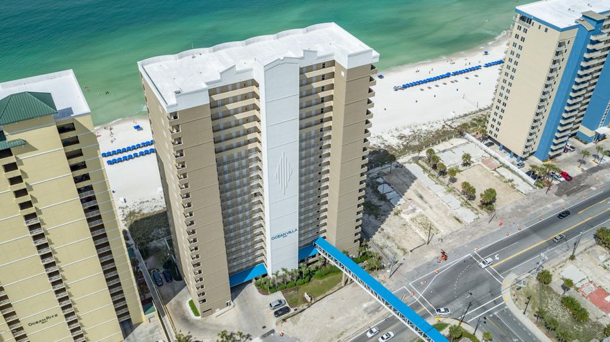VIRTUAL TOUR under photo tab. TOTALLY UPDATED!!! From the moment you open your front door, you have breath taking views of the emerald waters of the Gulf of Mexico and the pristine white sand beaches. Luxurious, 2 BR/2 BA, gulf front, west end unit is absolutely gorgeous! Spectacular sunset views! Owner has never rented this unit. NEW AC 2016, hot water heater & garbage disposal. Recent upgrades, travertine flooring throughout, freshly painted, all  Frigidaire gallery collection stainless steel appliances, under mount kitchen cabinet lighting, custom cabinets, custom lighting in pantry, door hardware, all lighting fixtures, all ceiling fans. Both bathrooms completely remodeled with new cabinets, granite counter tops and walk in showers, Master bath has custom design tiled shower with a built in bench. Custom shelving and lighting in all closets. Crown molding & 9 ft ceilings. This unit comes with a large owner's storage unit right outside your front door. Your fabulous 10' x 27' expansive, bowed balcony is accessible from the living area as well as the master suite. Amenities include two large gulf front pools, one heated, large hot tub, sauna, steam room, gulf front exercise room, gulf front pavilion with barbeque grills, owner's lounge, gulf front parking under complex as well as a parking garage across the street via enclosed walkover. Onsite HOA office, onsite rental company. Within walking distance to shopping, restaurants and entertainment. Gulf front living doesn't get any better than this!