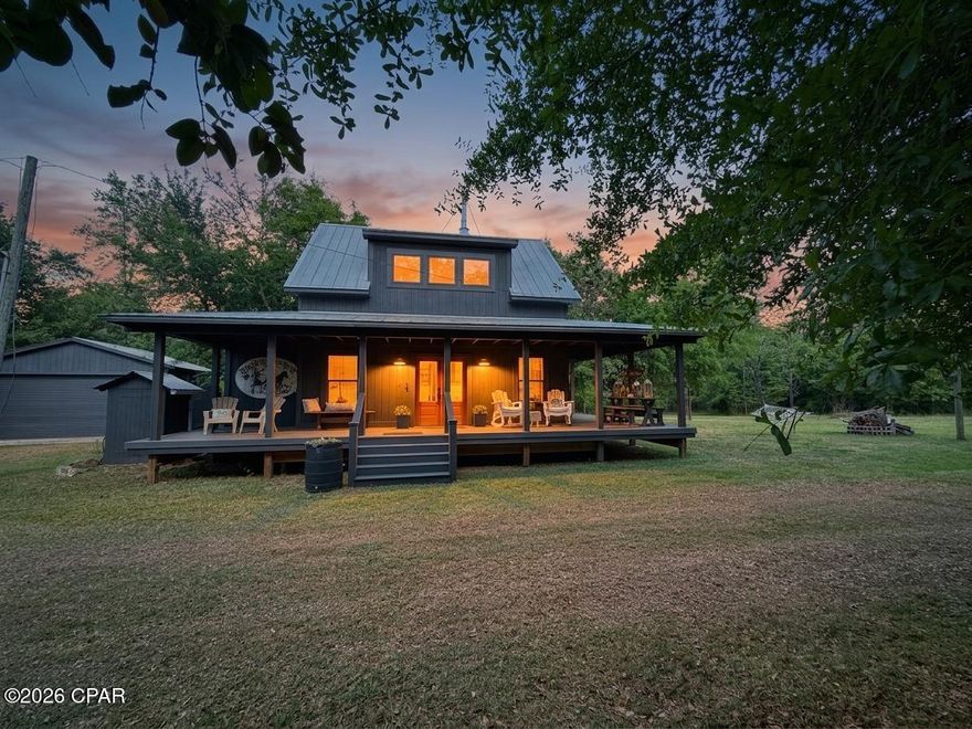 Experience the perfect blend of modern comfort and rustic charm in this beautifully crafted 2-bedroom, 2-bathroom modern farmhouse. Every detail has been thoughtfully designed, showcasing custom finishes throughout--from the striking wooden beam ceilings that add warmth and character, to the built-in bunk beds with elegant brass railings that create a one-of-a-kind space for guests or family.

The home's functional spaces are equally impressive, featuring a stylish laundry room with eye-catching herringbone tile flooring and expertly designed bathrooms that offer both sophistication and comfort. In the living room, custom-built bookshelves frame a sleek electric fireplace, creating a cozy yet refined focal point ideal for relaxing or entertaining. The living room is open to your dining area and chef's kitchen w/ stone counters & marble backsplash. 

Upstairs, the private primary suite is a true retreat, complete with a luxurious soaking tub that overlooks the serene surrounding land, as well as a separate shower for added convenience.

Step outside and embrace the peaceful lifestyle this property offers. Enjoy quiet mornings or evening gatherings on the expansive wraparound front porch, or unwind on the side deck surrounded by nature. For a truly unique touch, the galvanized outdoor shower lets you refresh while immersed in the natural setting.

Additional features include a detached garage with a roll-up door--perfect for parking, hobbies, or storage--along with a barn featuring double-door entry and a separate storage building, providing ample space for equipment, tools, or creative use.

This property is more than a home--it's a private escape where thoughtful design meets tranquil living.