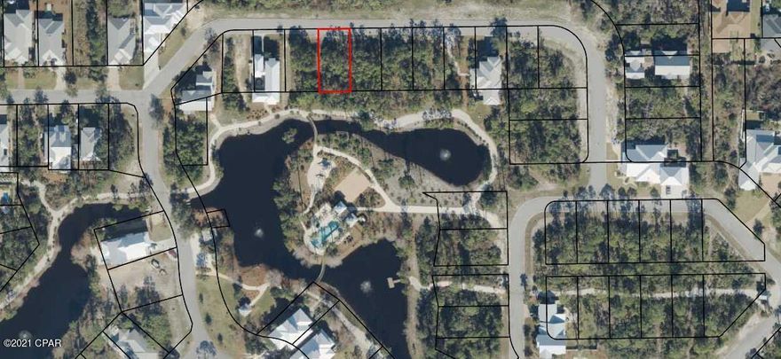 Large pond front lot in the desirable gated community of Martinique. Lot 51 is located on a quiet street in the back of Martinique. The adjacent lot, lot 50, is also for sale and offers the owner the opportunity to buy both for additional space and privacy. Martinique offers custom built homes with old Florida style architecture. The neighborhood features a pool, ponds, walking trails, playground and basketball court. It is also with in walking distance of a marina and several restaurants on the east end of Panama City Beach.