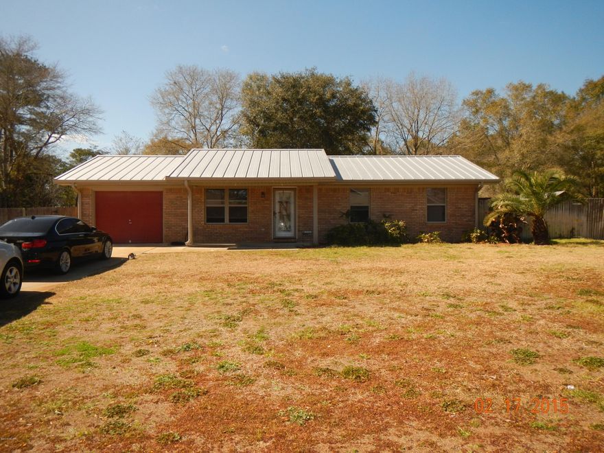 15 minutes to town on a peaceful half acre lot.  Move right in to this all brick ranch home with NEW metal roof, double pane windows, soffits, paint, flooring, pool liner and stainless steel appliances! When you enter through the front door you can see right out the sliding doors to the inviting patio and pool. This house is in great condition with crown molding,3 bedrooms and one bathroom with a new granite vanity. The master bedroom has separate access to the bathroom. The entire house has been freshly painted so there is nothing to do but bring your belongings.  The backyard is fenced with a large in-ground pool, two storage buildings, dog kennel and 30x30 cement slab for your boat or camper storage. Yard has a sprinkler system.  On well and septic for low utilities!