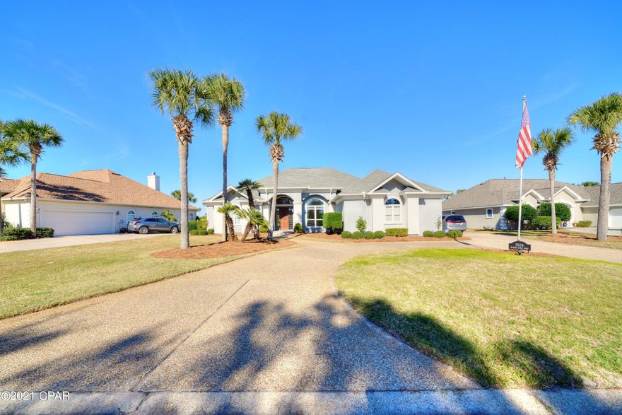 CURRENTLY UNDER CONTRACT, SELLER ACCEPTING BACKUP OFFERS! Stunning Panama City Beach home in Bay Point, located on popular Legend Hill's side with pool and 3 CAR GARAGE!  Entire interior of home newly painted, and gorgeous hardwood floors that have just been refinished or added throughout almost every room, and new carpet in all bedrooms.  Step inside to tall ceilings (14, 12, and 10 foot), crown molding, granite countertops, gas range, gas fireplace, convenient cabinet bar area next to fireplace, and central vac to name a few features.  Enjoy your outdoor oasis with heated pool, covered patio, and greenspace on one of the best home sites in all of Bay Point.  Beautiful views overlooking ponds on the Nicklaus course 10th green and 11th tee box.  Fenced in yard and MORE!!