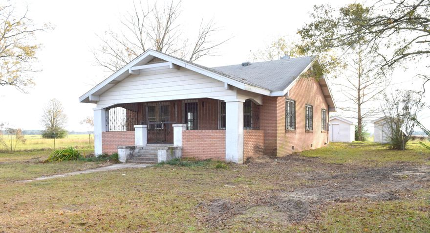 Filled with historic charm, this spacious country home is just waiting to be brought back to its former glory! Inside you will find 3-bedroom, 2 bath, hardwood flooring, 3 fireplaces, large living room and kitchen with farmhouse sink. Outside features include multiple out buildings and a covered front porch all sitting on over an acre lot directly off Hwy 79.