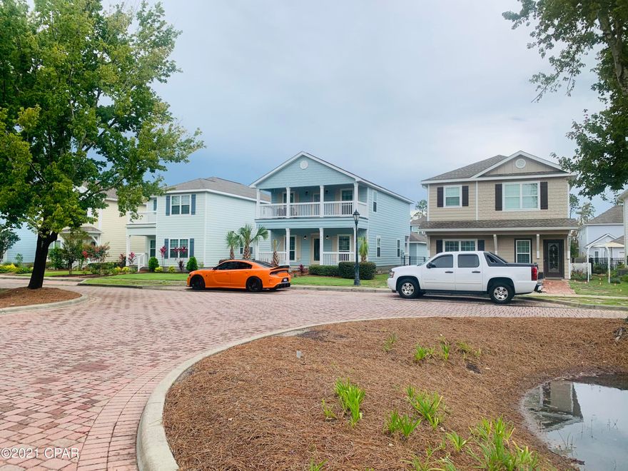 CURRENTLY UNDER CONTRACT, SELLER ACCEPTING BACKUP OFFERS. Here is your opportunity to own a little piece of paradise in Panama City Beach, Florida.  This craftsman style home is located in the popular bay front gated community of Magnolia Bay Club.  Magnolia Bay Club is a waterfront community with a pier, pool, play grounds, community room & walking path.  Spend endless summer days fishing on the pier and lounging around the pool.  Bay Point's Jack Nicholas executive golf course is also right around the corner for the avid golfer.  The home is constructed of sturdy & durable Hardie Board siding for easy maintenance and care.  There is parking in the front while also having a 2 car garage in the rear.  Master bedroom balcony with views of St. Andrews Bay. The open floor plan is perfect for entertaining with high ceilings, crown moulding and tile floors.  The kitchen is loaded with cabinets and counter space and features granite counter tops and a walk-in pantry.  Elegant stainless appliances and a gas stove for the chef.  The master bedroom will fit your king size furniture and you will love the exterior balcony.  Magnolia Bay Club is only minutes to the white sandy beaches of Panama City Beach, St. Andrews State  Park and world famous Capt. Anderson's restaurant and Schooner's Beach Club.  The HOA includes trash, basic cable, full landscaping, lawn irrigation, gated community, two playgrounds, community pool, fitness gym, fishing pier and walking path!