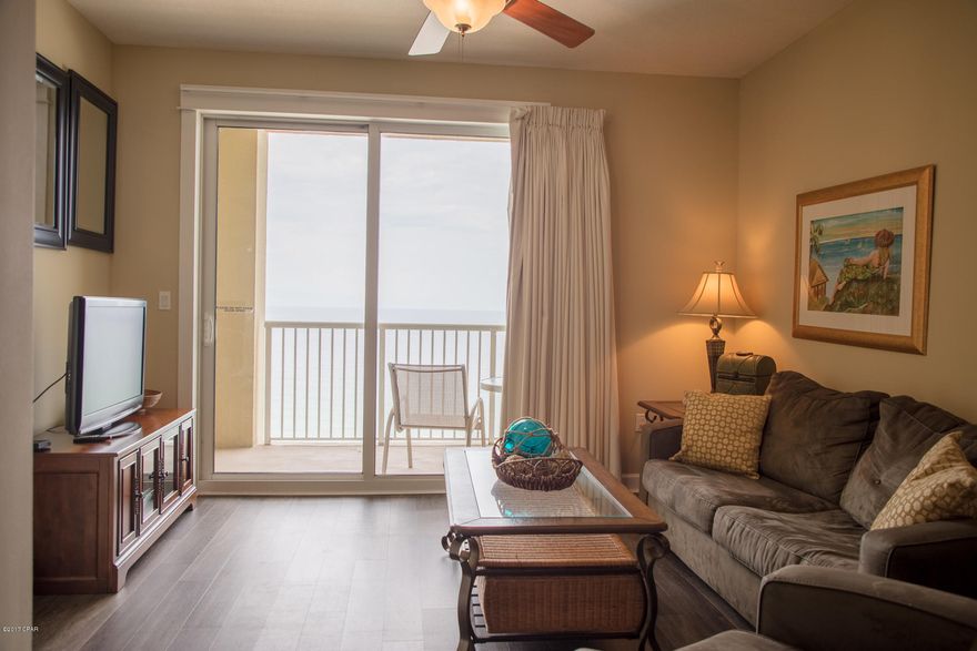 Stunning Gulf Front Condo located on the Worlds Most Beautiful Beaches!!! This 2 bedroom  unit is fully furnished and professionally decorated.  It features a large open kitchen with solid surface countertops and stainless appliances, it is open to the living room and offers  Gulf views from just about every angle! Large master suite with patio and walk in closet. The additional bedroom and bath a large and offer plenty of space for short or long term guests!    No details spared on this amazing condo. Grand Panama offers an onsite rental company, shops and restaurants.  Call today for your own private showing appt.