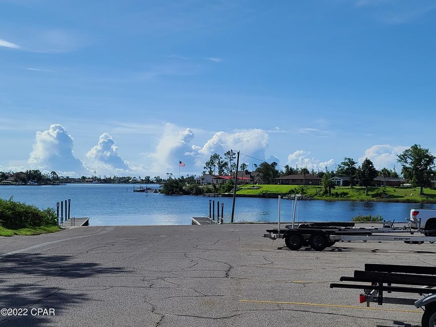 Under Contract, seller will consider backup offers. Manufactured home is not a problem. Over half of an acre located on a paved road in Callaway.  This large lot is zoned as an R6-M, meant for single family residential but will allow manufactured homes. You will find that you are literally moments away from parks and boat ramps for all of the family to enjoy.  You are within 1/2 mile from water. A 3 minute drive and you can back your boat into the public ramp and be fishing within moments or enjoying Shell Island and then make your way to the Gulf for some deep water action. You will also find that you are less than 5 minutes from shopping, gas, restaurants and grocery stores galore. Approximately 10 minutes to Tyndall Air Force Base.