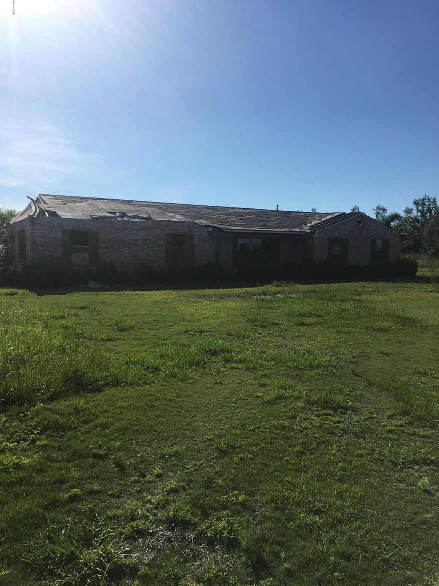 20 acres consisting of mostly pasture that would be perfect for a small farm, recreational use, or home site in rural area, but close to Marianna and Blountstown. There is 2,406 sq ft home on the property that was badly damaged in Hurricane Michael and needs extensive repairs.