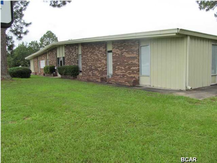 Hard to find Commercially Zoned property in the Lynn Haven market area. The building is 26,300 SF, and combines 4,430 SF of office space and 21,870 SF of warehouse. Building can be divided into a variety of office and warehouse combinations. This offering includes 7,980 SF (Warehouse Area C) of 21,870 SF (Entire Warehouse)and includes 1 office, 1 restroom, 1 dock-high loading dock with 1,944 SF covered loading area and 3 roll up doors. The entire warehouse area is divisible ($4.50 SF Warehouse Only) has 9 roll up doors in multiple sizes, 14 and 18 ft. eves, large office with window AC unit, break room, 2 restrooms, and a dock-high loading dock with a 1,944 SF outdoor covered loading and work area. The yard area is completely fenced with 2 entry points from Minnesota Avenue and