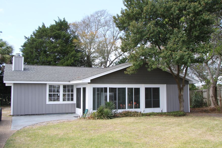 LIKE NEW! Move in Ready! This 3 Bed/2 bath home is Freshly Painted! 2018 Updates include New Kitchen cabinets with granite, glass tiled backsplash, and 4 pc Stainless appliances, PLUS new carpet in the bedrooms. ALSO Brand new in 2018 Board & Batten vinyl siding, soffits and fascia  means never having to paint the exterior! Bathrooms have updated vanities and new toilets and master bath has a new shower. Modernized fireplace surround, new energy efficient windows, Brand new Hot water heater,  HVAC less than 2 years old, Architectural Shingle Roof installed in 2009, plus lots more!.  This is a GREAT beach home in the  GREAT neighborhood of Open Sands - a short distance to Pier Park and the beautiful beaches, Golf cart friendly community - pack your cart and hit the beach!