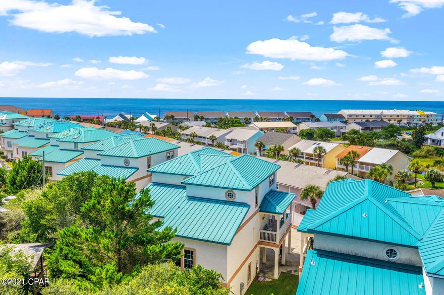 CURRENTLY UNDER CONTRACT. SELLER ACCEPTING BACKUP OFFERS. Looking for the perfect beach home / vacation rental investment opportunity? Welcome to your new Beach Home, with gorgeous views of the Gulf of Mexico, located on the West End of Panama City Beach, FL! This beautifully furnished 3 bedroom, 3 bathroom townhome, with Gulf Views, has three levels of generous living space and plenty of room to entertain. The bottom floor is a studio, lock-out unit, complete with a large living/sleeping and small kitchen area, full bath and covered patio with private outdoor living patio. The first floor studio has a separate entrance from the 2nd and 3rd level living areas, and can be rented or used separately. View 3d virtual tour here---> https://www.zillow.com/view-3d-home/cfc936b6-6392-491d-9f96-74b7316d7a49?setAttribution=mls&wl=tru On the second level you will find an open living, dining and kitchen area, featuring 10 foot ceilings throughout, with two separate balconies perfect for enjoying your morning coffee, and there is also a second level guest bedroom and full bathroom. The third level features a spacious master suite, which includes a separate balcony, where you can enjoy gorgeous views of the Gulf of Mexico. The large Master Bath has a separate shower and jetted tub. This townhome is located in the quiet community of The Palms, which is directly across the street from the Gulf of Mexico, and comes with two parking spaces and Golf Cart parking. Enjoy the Palms' community amenities which include a community pool, hot tub, dry sauna, and gas grills. HOA fees are only $275 per month. This is the perfect home for year-round living, second home, or great rental income generating opportunity. This beach home is currently used as a vacation rental property and it's already grossed over $60K in rental income for 2021. Completely turnkey property and rental program fully transferable to buyer as seller will transfer management program, listings with established reviews, cleaning staff and maintenance staff if interested in continuing to use this beach house as an income generating property.  Call to see this beach home in person today!