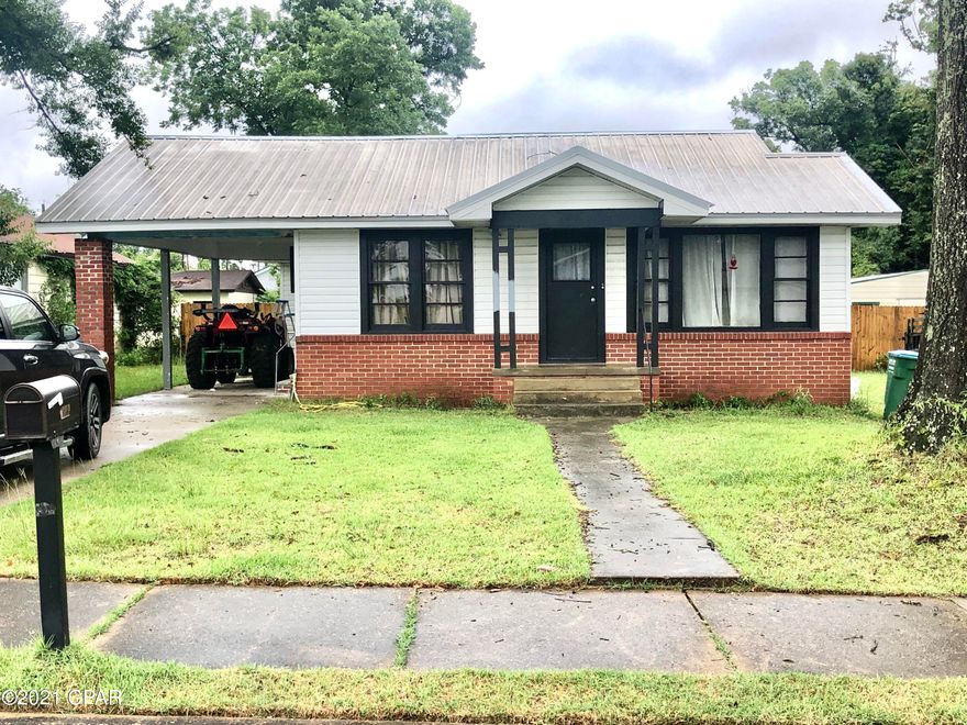 Affordable 3/2 in Marianna with a carport and hardwood floors.  Spacious living room/Dining/Kitchen. Split bedroom plan.  Big concrete detached storage or man cave.  Convenient to Jackson Hospital, Shopping, Chipola College.  This would make an excellent first home, or great rental unit for income.  Purchase the house next door for 39,500 live in one and rent the other or use as a mother in law suite.  Don't let this one get by you.