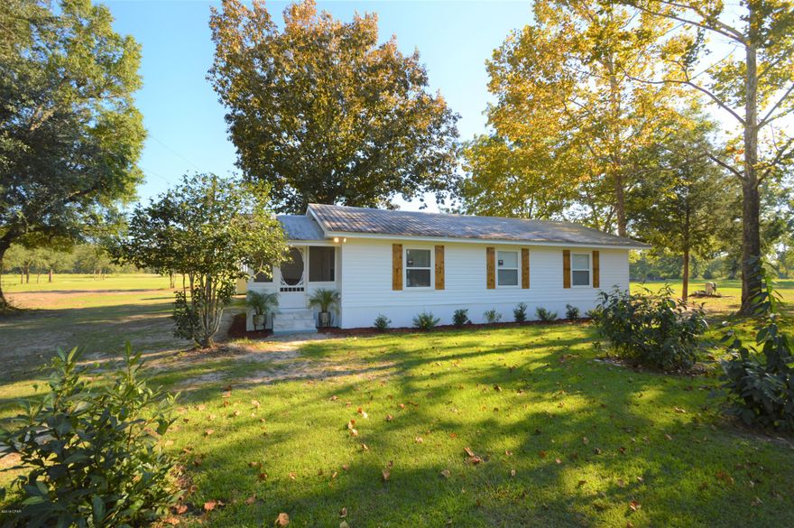Cute Home in the Country.... Three bedroom one bath like new. Completely remodeled with new wiring, plumbing, ac, windows, and much more. Living is open to dining area and custom kitchen with granite counter tops and stainless steel appliances. Utility room tucked away behind barn door. Bath is completely new with tiled tub/shower unit. Vinyl Plank floor throughout. Adorable screened porch with open deck in the back.