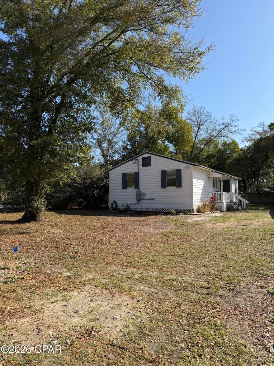 HISTORIC FLORIDA COTTAGE NEAR THE WATER, Welcome to 808 1/2 Mulberry Ave., an inviting Florida cottage located in the heart of Panama City's historic district. Just a quarter mile from the water and within walking distance to downtown Panama City and Beach Drive, this home offers a perfect blend of coastal charm, convenience, and investment potential. This spacious home features a comfortable split-bedroom floor plan with three bedrooms and two bathrooms, one of which has been recently remodeled adding modern style and comfort. A bright Florida/Sun room provides additional living space-perfect for relaxing, or creating a home office. Recent updates include a new roof installed in 2019, new air conditioning and updated flooring, offering peace of mind for future owners. The property also features a large fully fenced backyard with alley access, a storage shed, and plenty of space for outdoor living, pets, gardening, or entertaining. The home is served by city water and sewer and sits in a charming neighborhood that offers a unique blend of established family homes and small business owners, contributing to the area's vibrant local character. Located clost to the marina and waterfront, this property is just a short drive to the beautiful Gulf beaches, making it an ideal primary residence, second home, or income producing vacation rental. With it's desirable location near downtown attractions, restaurants, shops and coastal recreation, this property presents an excellent opportunity to enjoy the best of Panama City living. Professionall photos of interior of property coming soon.