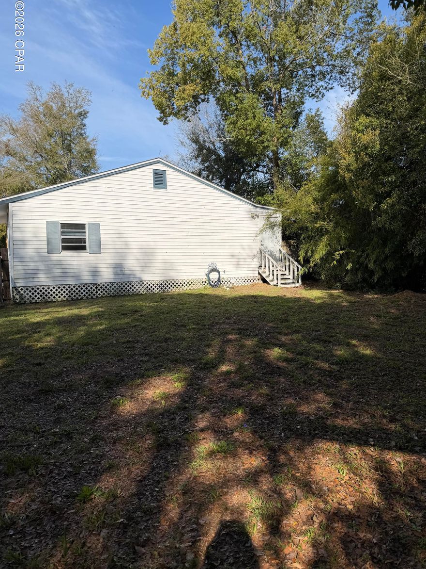 HISTORIC FLORIDA COTTAGE NEAR THE WATER, Welcome to 808 1/2 Mulberry Ave., an inviting Florida cottage located in the heart of Panama City's historic district. Just a quarter mile from the water and within walking distance to downtown Panama City and Beach Drive, this home offers a perfect blend of coastal charm, convenience, and investment potential. This spacious home features a comfortable split-bedroom floor plan with three bedrooms and two bathrooms, one of which has been recently remodeled adding modern style and comfort. A bright Florida/Sun room provides additional living space-perfect for relaxing, or creating a home office. Recent updates include a new roof installed in 2019, new air conditioning and updated flooring, offering peace of mind for future owners. The property also features a large fully fenced backyard with alley access, a storage shed, and plenty of space for outdoor living, pets, gardening, or entertaining. The home is served by city water and sewer and sits in a charming neighborhood that offers a unique blend of established family homes and small business owners, contributing to the area's vibrant local character. Located clost to the marina and waterfront, this property is just a short drive to the beautiful Gulf beaches, making it an ideal primary residence, second home, or income producing vacation rental. With it's desirable location near downtown attractions, restaurants, shops and coastal recreation, this property presents an excellent opportunity to enjoy the best of Panama City living. Professionall photos of interior of property coming soon.