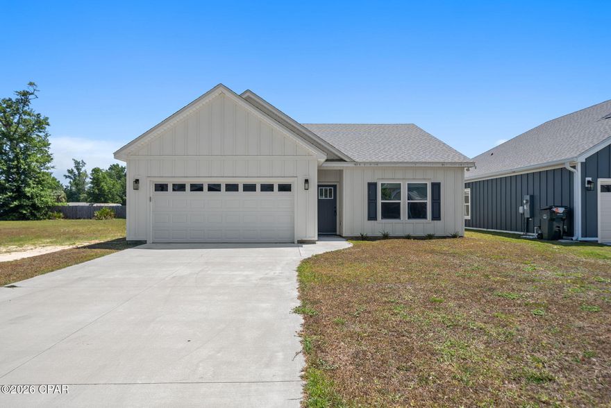 If you've been searching for the feel of new construction with the added confidence of newer major systems already in place, this is it. Built in 2024, this home offers the kind of peace of mind buyers are looking for--without the wait or uncertainty of building.

Step inside to a bright, thoughtfully designed layout featuring 9-foot ceilings and luxury vinyl plank flooring throughout, creating a clean, modern feel from the moment you enter. The open-concept living space flows effortlessly into a beautifully finished kitchen with quartz countertops, shaker-style cabinetry, stainless steel appliances, and a spacious island perfect for gathering.

The split floor plan offers privacy and functionality, with two secondary bedrooms and a full guest bath--complete with double vanities--positioned just off the foyer. The primary suite is tucked away and designed to feel like a retreat, featuring a tray ceiling, walk-in closet, and a spa-inspired bathroom with quartz countertops and a tiled shower.

Located in the highly sought-after Lynn Haven area, you're just minutes from some of the area's most loved spots like Cain Griffin Park, Sharon Sheffield Park, and the Lynn Haven Bayou Park and Preserve,  along with shopping, dining, and top-rated schools.

Modern finishes. Major updates. Prime location. Call your favorite realtor today to schedule your showing.