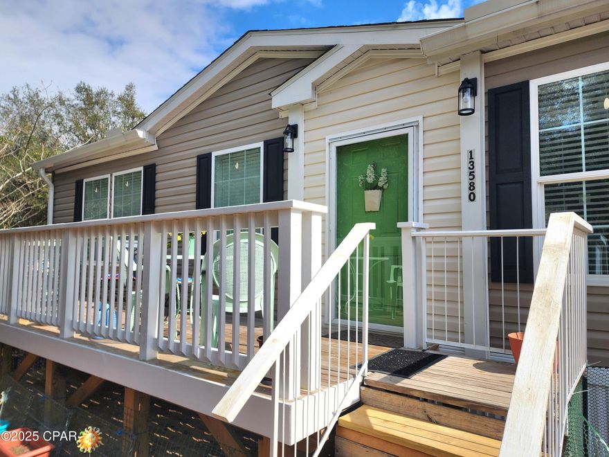 'CURRENTLY UNDER CONTRACT, SELLER WILL CONSIDER BACKUP OFFERS' 
This double wide mobile home set on Brit Lake in Panama City is a gem in the making. With 3 bedrooms and 2 baths and lots of space, this is the perfect place to call home. 
There is a 30x30 shop with concrete floor and power. Great for working on all your toys, store your boat or use as additional storage. Sitting in the living room you can look out and enjoy the view of the lake. Quiet undeveloped street. This lot has room to grow with enough area for a pool and any other amenities you want to add to make this great lot and home your own.
With a spacious living area inside the home you will find a great open floor plan with the kitchen and dining area flowing into the large living room with built in bookshelves. The bedrooms are split with the master on one end and the other two bedrooms by the large laundry room on the opposite side, so there is plenty of privacy for everyone. This is country living close to everything you need for shopping, restaurants, and more and only 25 minutes from the sandy white beaches of Panama City Beach. 
Don't let this great property under 300k pass you by. 
All items of importance, measurements, etc. to be confirmed by buyers agent or buyers.