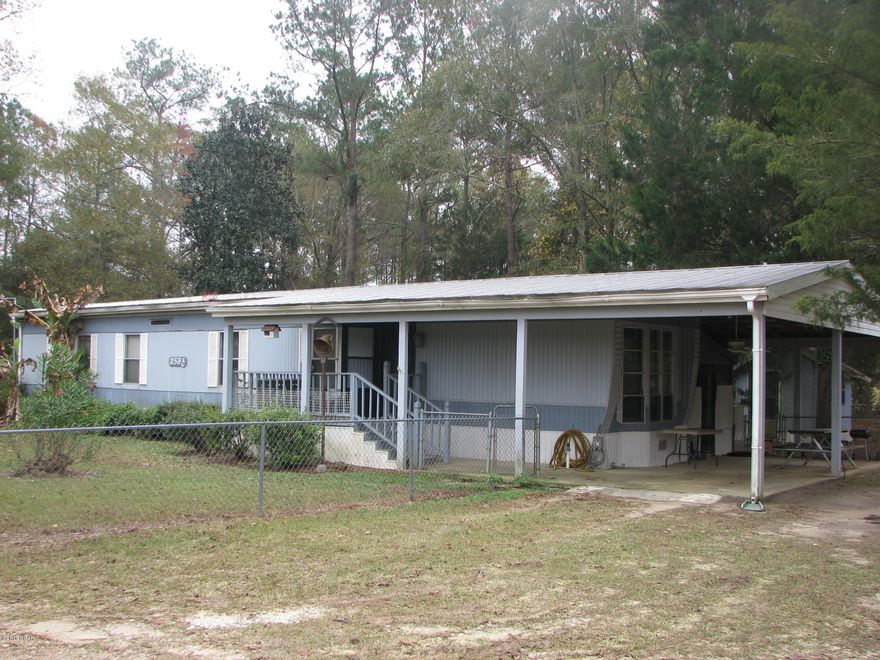 Here is your chance to own your very own get away! This 2 bedroom, 2 bathroom home sits on 2.58 acres just outside of Marianna. It has an open kitchen and living area and a huge screened porch on the back- perfect for entertaining! The master has a large dressing/bathroom area open to the bedroom. You'll appreciate the 2 large outbuildings- great for storage, boats, or toys! Come enjoy this private country setting.