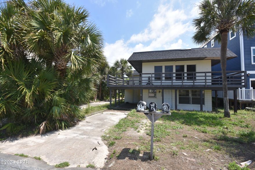 Currently under contract - Seller will consider backup offers. Welcome to 212 Gulf Lane, where prime location meets investment potential. Nestled just one short block away from the glistening shores of the beach, this property presents a rare opportunity for those seeking to own a piece of paradise.

Situated on the serene shores of Lullwater Lake, the property boasts tranquil views and a serene ambiance, perfect for relaxation and unwinding. Whether you're a nature enthusiast or simply enjoy the calming presence of water, this location offers a peaceful retreat from the hustle and bustle of everyday life.

This triplex offers versatility and opportunity. With three separate units, there's potential for rental income or even the chance to live in one unit while renovating the others. The fixer-upper aspect allows for customization and personalization to suit your vision and needs. While it may need some work, the investment potential is undeniable.

Location is everything, and this property doesn't disappoint. Within walking distance, you'll find the vibrant energy of Pier Park and Russell Fields Pier. Indulge in a leisurely stroll along the pier, take in panoramic views of the Gulf, or explore the myriad of shops, restaurants, and entertainment options that Pier Park has to offer.

Whether you're seeking a lucrative investment opportunity or envisioning your dream coastal retreat, 212 Gulf Lane delivers on both fronts. With its unbeatable location, proximity to the beach, and potential for customization, this property is primed to become your own slice of paradise. Don't miss out on the chance to make this fixer-upper your own and capitalize on all that this remarkable location has to​​‌​​​​‌​‌​​​​‌​​‌​​​​‌‌ offer.