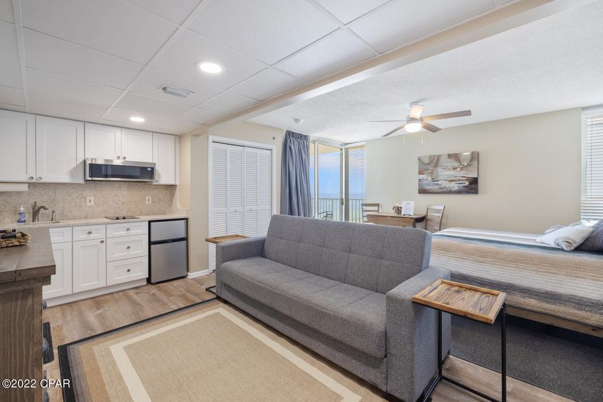 'CURRENTLY UNDER CONTRACT, SELLER WILL CONSIDER BACKUP OFFERS' 

 UPDATED STUDIO! Enjoy magnificent westward views of the white sandy beach, emerald green waters and gorgeous sunsets, all from the comfort of the Gulf front balcony. This property is located on the 8th floor level of Tower IV within Long Beach Resort. Lovely improvements were made to the kitchenette area in 2021, including quartz countertops, under mounted sink, soft close cabinets and a low profile microwave oven. A two burner cooktop, under counter refrigerator, and portable toaster oven are perfect additions to this cozy condominium. The air handler was replaced in Feb. 2022. Just off the sitting area, the full bathroom has a standalone shower, an updated quartz vanity and cabinet, with a beautiful modern bowl sink. Adjacent to the bathroom area, the unit comes equipped with a stackable washer/dryer, which is a great convenience. The flooring has was replaced throughout the unit in 2021 with luxury vinyl plank. This outstanding condo has been tastefully decorated with costal style furnishings and is rental ready.
Long Beach Resort is known for its lush landscape and beautiful lagoon style pool with tranquil waterfalls. In addition, two other pools and three whirlpools are located within the resort. The "Hangout" poolside bar and grill is convenient for those wanting to grab a quick bite to eat while still enjoying fun in the sun. Onsite security with a controlled access gate is available 24 hours per day. Parking is located on ground level, on the same side of the road as the resort, so no parking garage to maneuver. Schedule an appointment to see this outstanding property today!