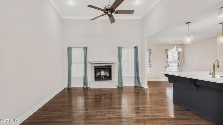 IMMACULATE ALL-BRICK HOME in the desirable community of Camryn's Crossing!  This three bedroom/two bath home WITH a separate private office or den features all wood flooring throughout the living areas; a kitchen with solid-surface counters, stainless steel appliances and a breakfast bar that opens to both the Great room with a fireplace as well as the dining area.  The Master bedroom has tray ceilings and a Master bath with double sinks, garden tub, separate shower and a large walk-in closet.  The screened porch overlooks the fenced back yard with a separate open patio designed with brick pavers.  And, the community has a playground that is perfect for all ages!  This home is move-in ready and only steps to both Mosley HS and the Bay Haven Charter Schools!