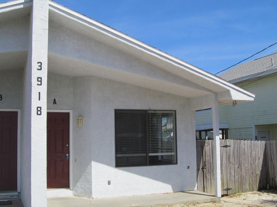 Walk to the beach- 1 bedroom 1 bath duplex- new flooring- newly painted- breakfast bar- laundry area for full size washer & dryer. This home offers a patio &  shared fenced back yard for semi privacy.

Lawn service is included- this property is on septic.