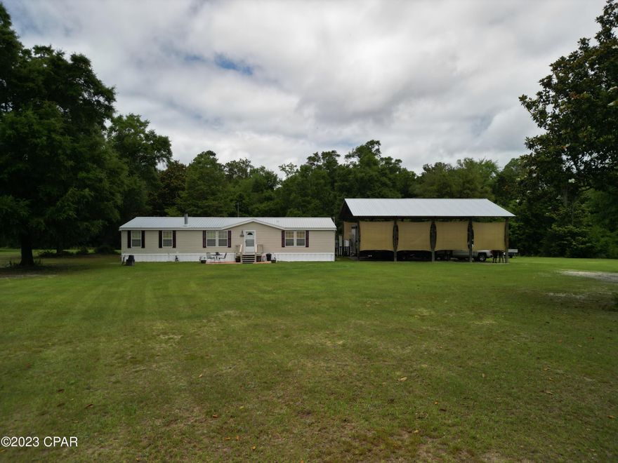 Location! Location! Location! This home provides the luxury of rural living but also allows quick access to Tallahassee with a 15 minute drive. This home is very near a fire station, community center, newly built park/playground, and public library. This home is immaculately maintained and spacious! This property is equipped with over 2000 sq feet of living space, 13.25 acres, walk in closets in each bedroom, 2 hallways closets, a pantry, a spacious master bath, front porch, 36x48 pole barn, and enclosed 12x32 work shed with added 18x32 lean-to for storage. The majority of the property has been cleared aside from roughly 2 acres which has creek access. The Lake Talquin State Park adjoins the property to the North. 

If you are looking for privacy and peace, this is the ideal location!