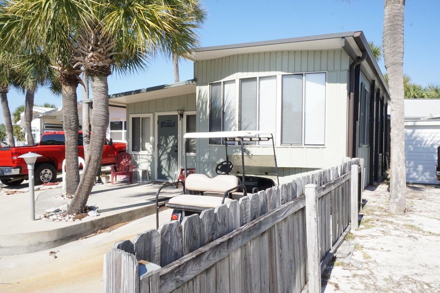 Check out this 2 bedroom 2 bath Venture Out home! Wonderful location within the resort. Great potential here for investment or 2nd home. Venture Out has 300' on the beautiful pristine beaches of the Gulf of Mexico and 1,000' on the Grand Lagoon. Venture Out has something for everyone. With two salt water pools (one heated), fishing pier, boat ramp, mini golf, children's play ground and much more.